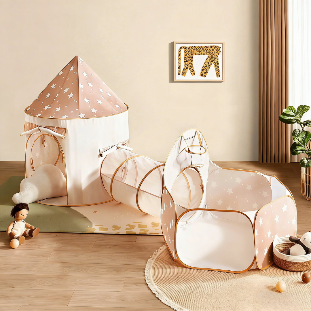The Tiny Land® Compact Adventure 3-in-1 Play Tunnel sits on a wooden floor surrounded by toys, a plush doll, and soft balls, while a giraffe print decorates the wall. Note: Balls are not included with this Tiny Land product.