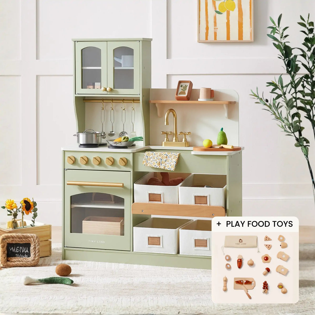 The Tiny Land® Smart Storage Kitchen Cooking Set by Tiny Land is a pastel green wooden play kitchen with toy cookware, utensils, a sink, stovetop, oven, drawers, shelves, baskets, and a wooden coffee maker. Play food toys are included in the inset.