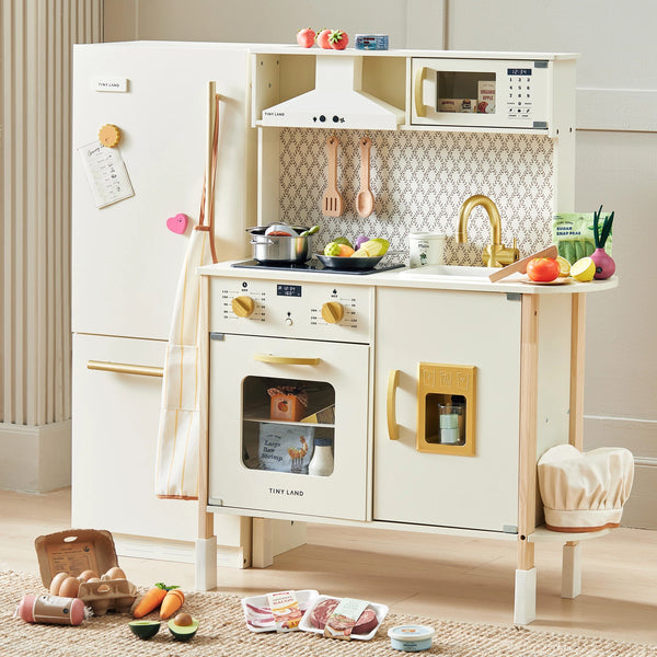The Tiny Land® Farm-to-Table Play Set includes an interactive kitchen, storage fridge, and organic food collection. Kids can enjoy pretend play with fruits, vegetables, and grocery items from Tiny Land scattered in their own mini kitchen.