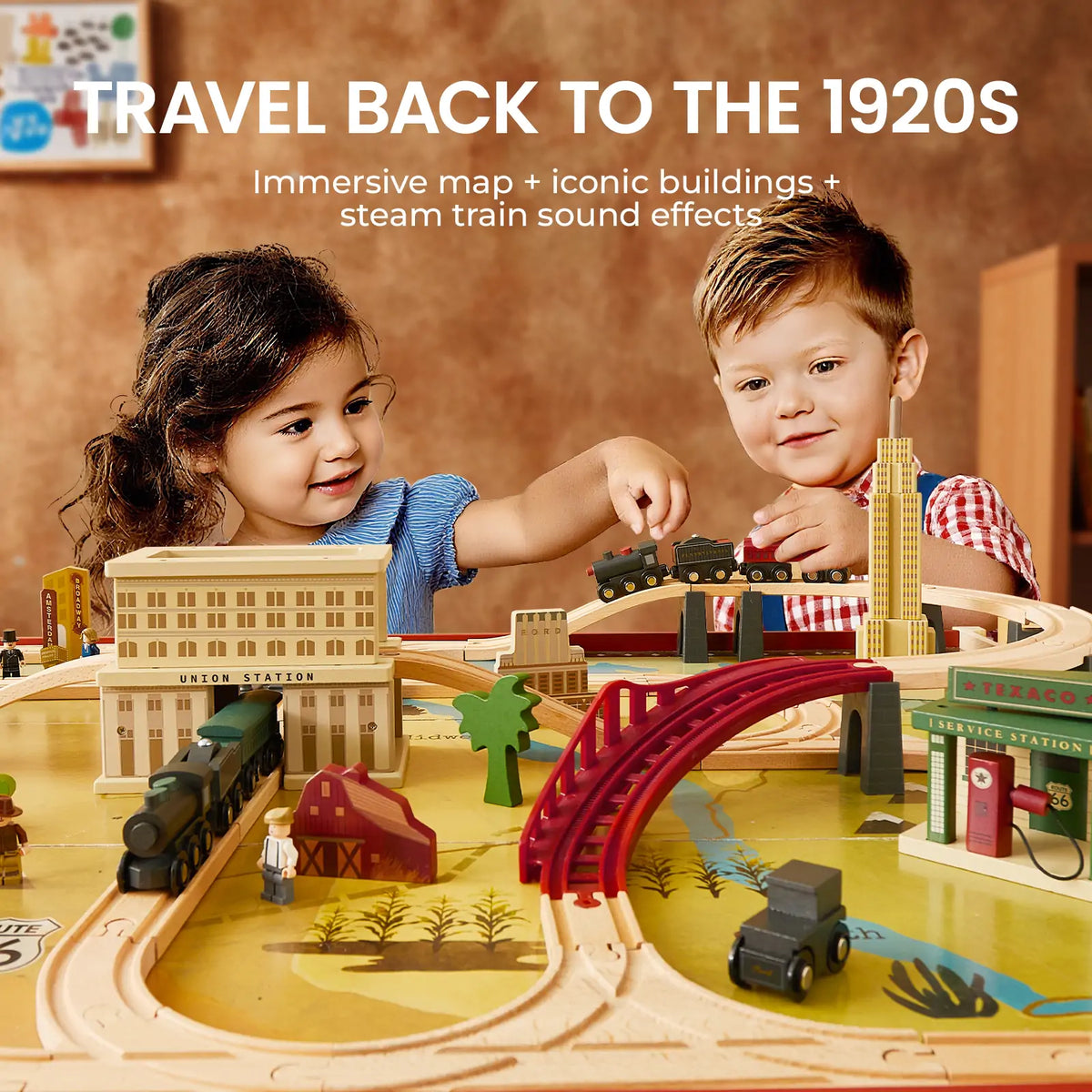 Two kids enjoy the Tiny Land® 1920 Railway Adventure Train Table by Tiny Land INC, featuring a 1920s train set, mini buildings, tracks, and steam train sounds. Text: “Travel back to the 1920s—Immersive map, iconic buildings, steam train sound effects.”.