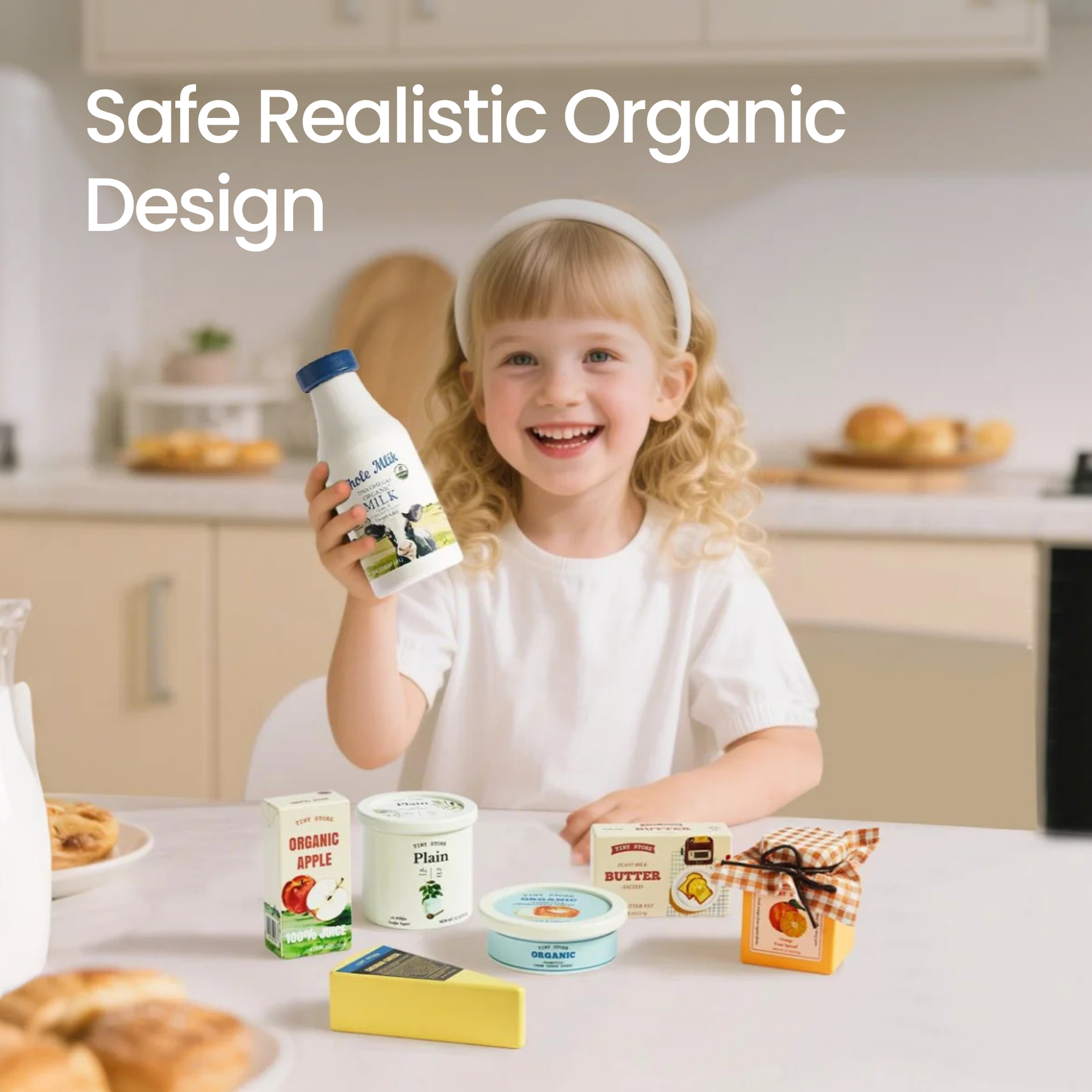 A smiling blonde girl holds the Tiny Land® Organic Dairy Pack by Tiny Land INC at a kitchen table, surrounded by pretend food and organic packaging. Text: Safe Realistic Organic Design.