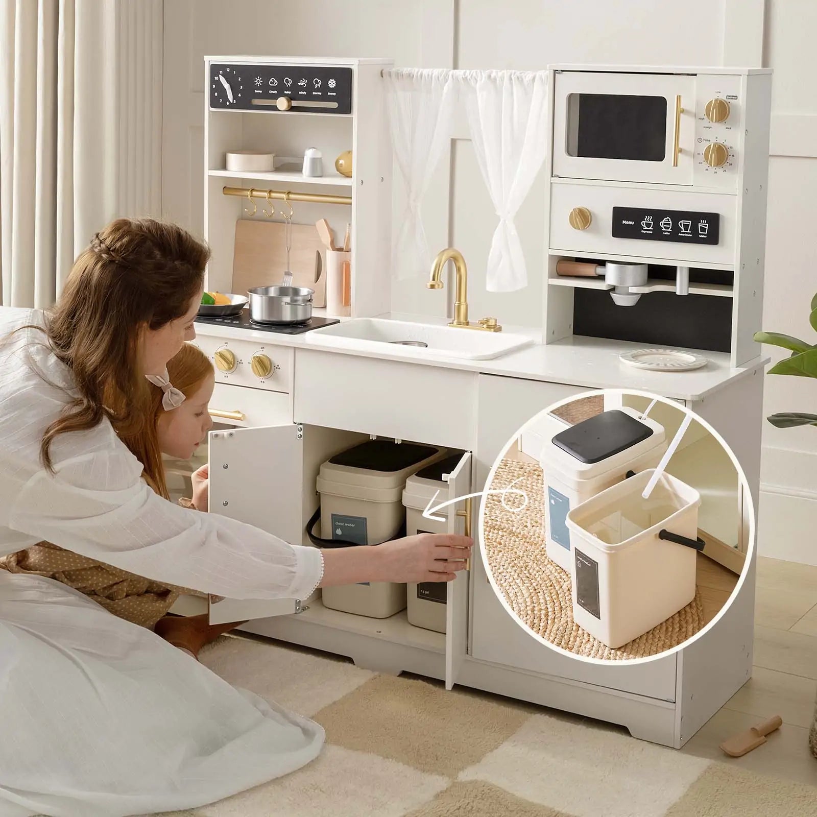 A woman and child kneel by the Tiny Land® Play Kitchen with Running Water - Iconic Aqua Kitchen in Cream, opening a cabinet to reveal a small beige compost bin inside. An inset shows the compost bin from Tiny Land with its black lid open.