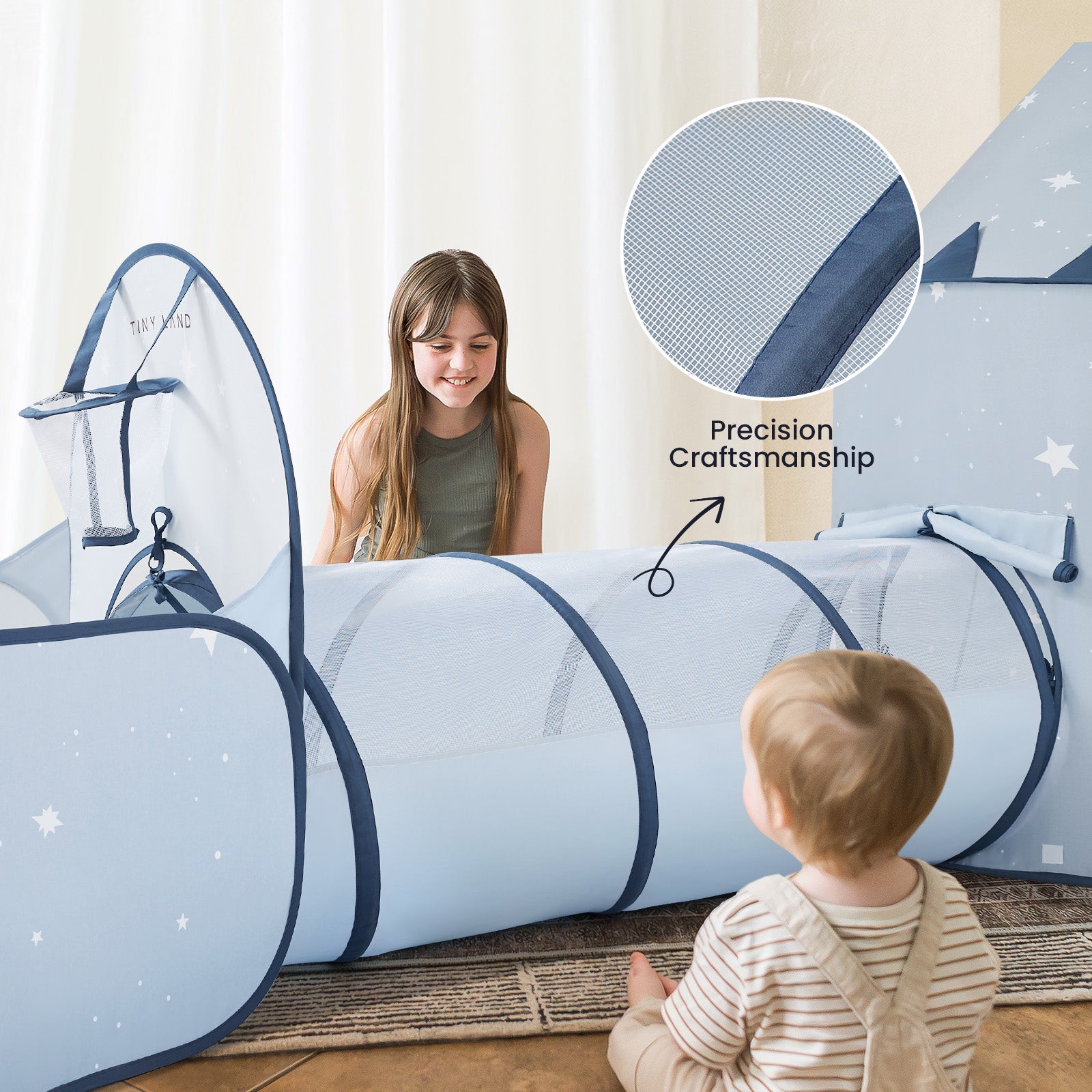 A young girl and toddler play with the Tiny Land® Compact Adventure 3-in-1 Play Tunnel in blue, featuring star patterns and mesh for durability—perfect to pair with any kids' tent or ball pit. Brand: Tiny Land. No balls included.