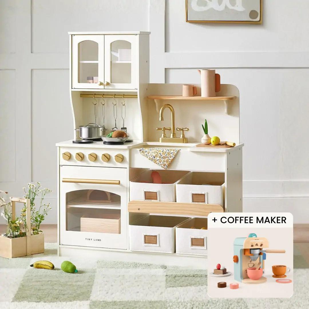 The Tiny Land® Bakery & Cafe Playset—Storage Kitchen + Coffee Maker by Tiny Land features an oven, stovetop, sink, shelves, bins, and a coffee maker with cups for endless pretend play in any cozy room.