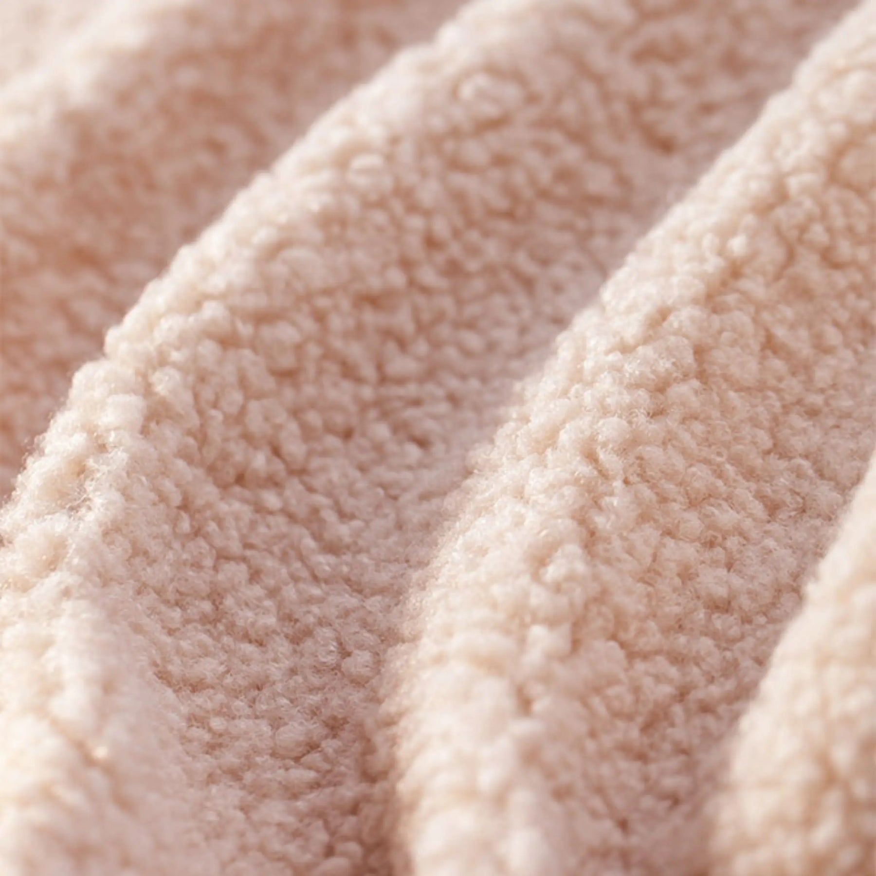 Close-up of the soft, textured fabric on the Tiny Land® Afternoon Couch - Pink Kids Chair by Tiny Land, featuring a fleece-like, fluffy surface with raised wavy ridges—perfect for toddler comfort.