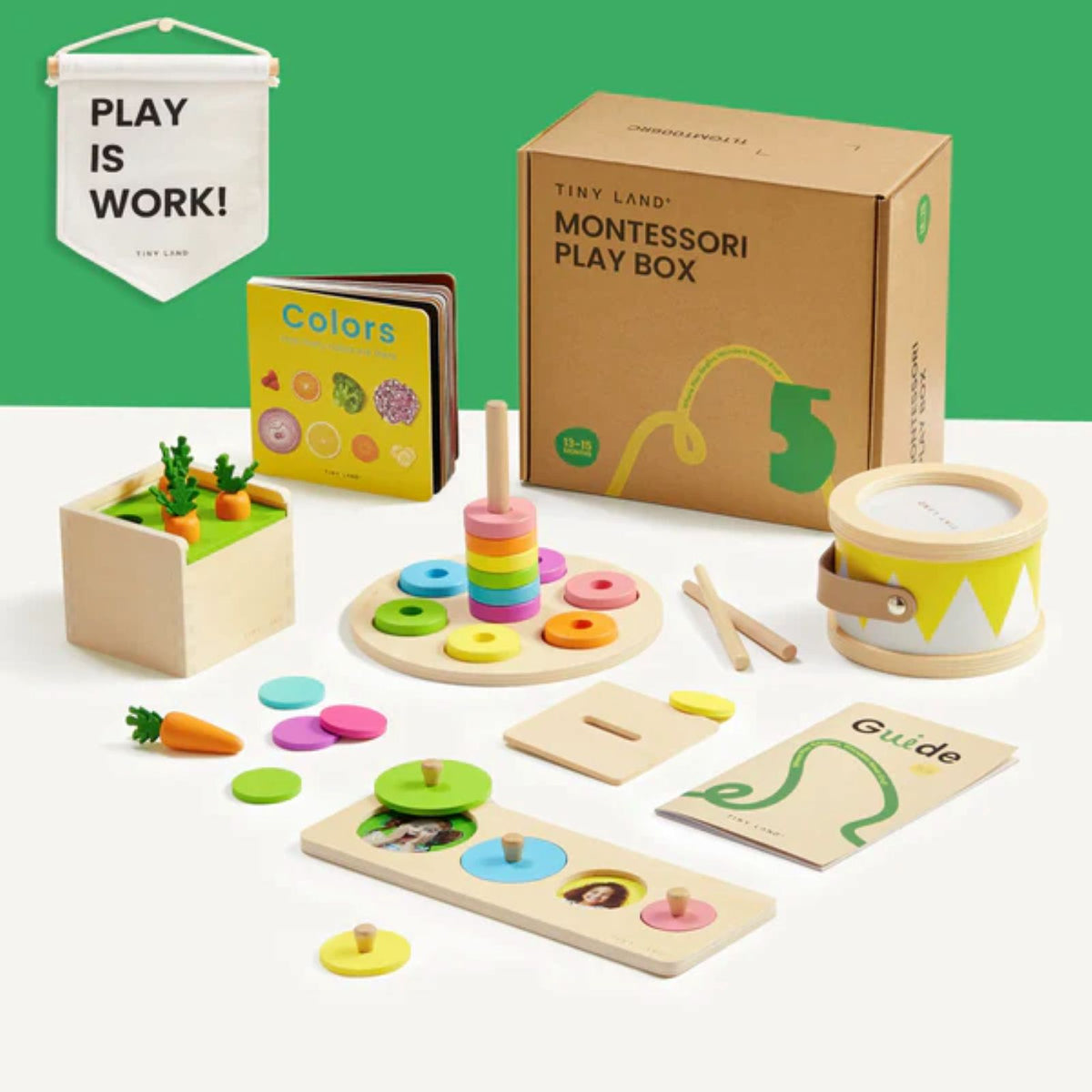 The Tiny Land® Montessori Complete Baby Set (0-24 months) by Tiny Land features wooden toys, a stacking ring, drum, color book, vegetable box, sorting puzzle, and a PLAY IS WORK! banner to encourage sensory play and fine motor skill development.