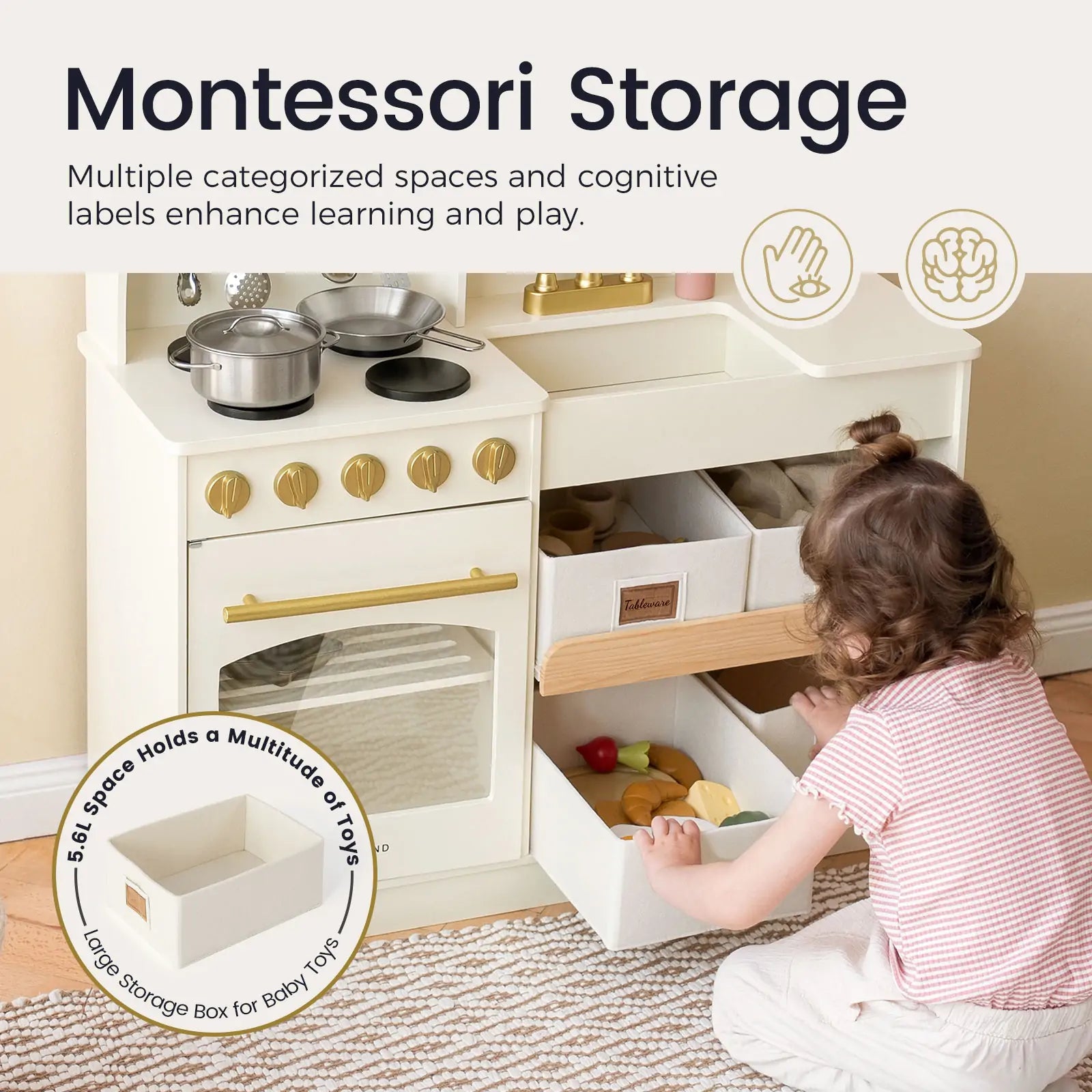 A toddler sorts play food into bins in the Tiny Land® Wooden Play Kitchen with Storage by Tiny Land. Montessori storage features cognitive labels and compartments for organizing pretend cookware and toys, promoting creative play.