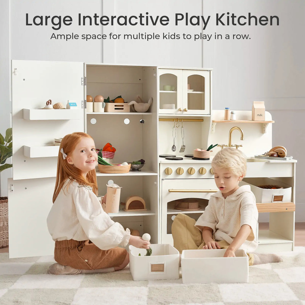 Two kids enjoy imaginative play with the Tiny Land Food-Filled Kitchen Gift Set, featuring a storage kitchen, fridge, pretend appliances, shelves, cabinets, and an organic food collection—perfect for creative fun together.