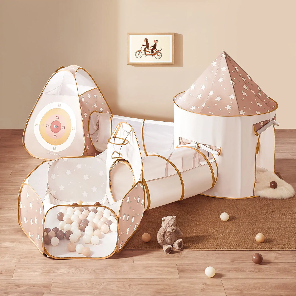 The Tiny Land® Discovery 5-in-1 Play Tunnel & Ocean Ball Set features a beige and white tent, play tunnel, ball pit with pastel ocean balls, star patterns, and accessories—ideal for active children’s indoor play.
