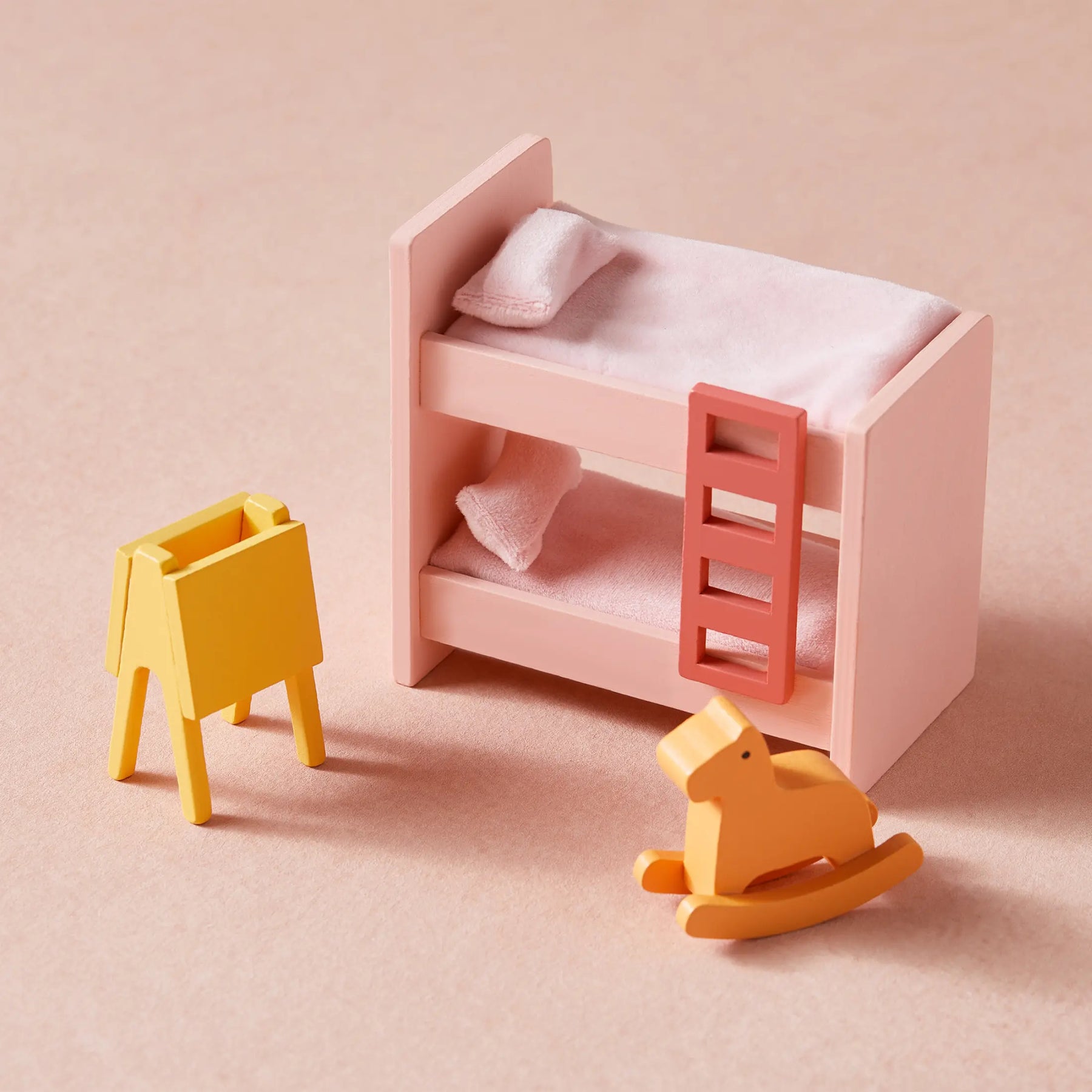 The Tiny Land® Sweetwood Love Dollhouse without Dolls by Tiny Land features a pink bunk bed with bedding, a small yellow easel, and a tiny yellow rocking horse—perfect for inspiring imaginative play.