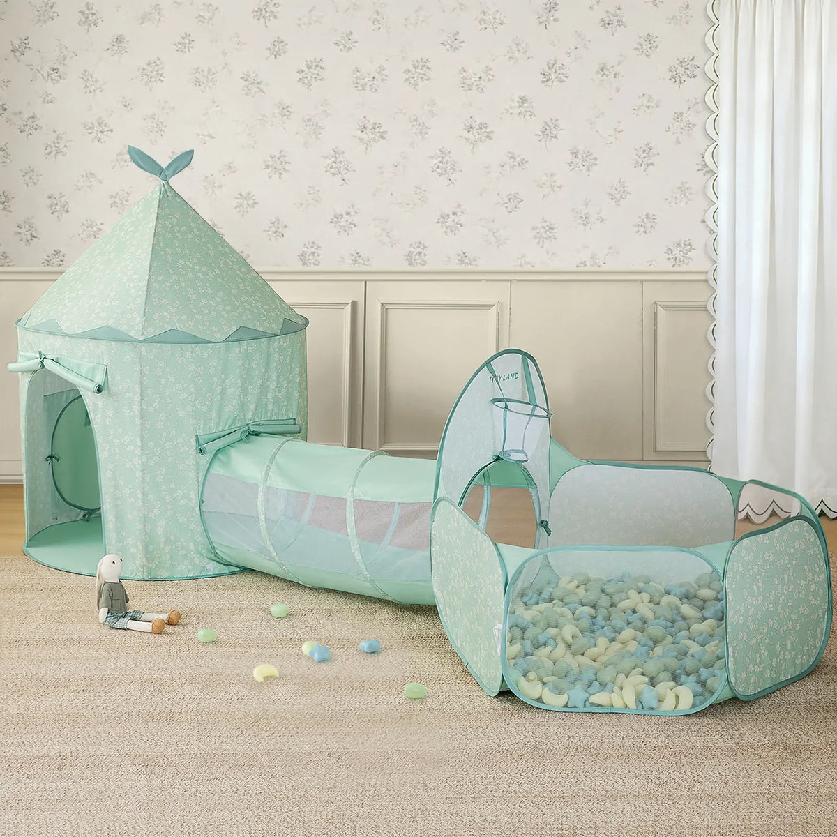 The Tiny Land® Green Adventure 3-in-1 Play Tunnel & Fun-Shapes Ocean Ball Set by Tiny Land includes a castle-shaped tent, connecting tunnel, and ball pit with fun-shape balls—ideal for sensory play on any carpeted area.