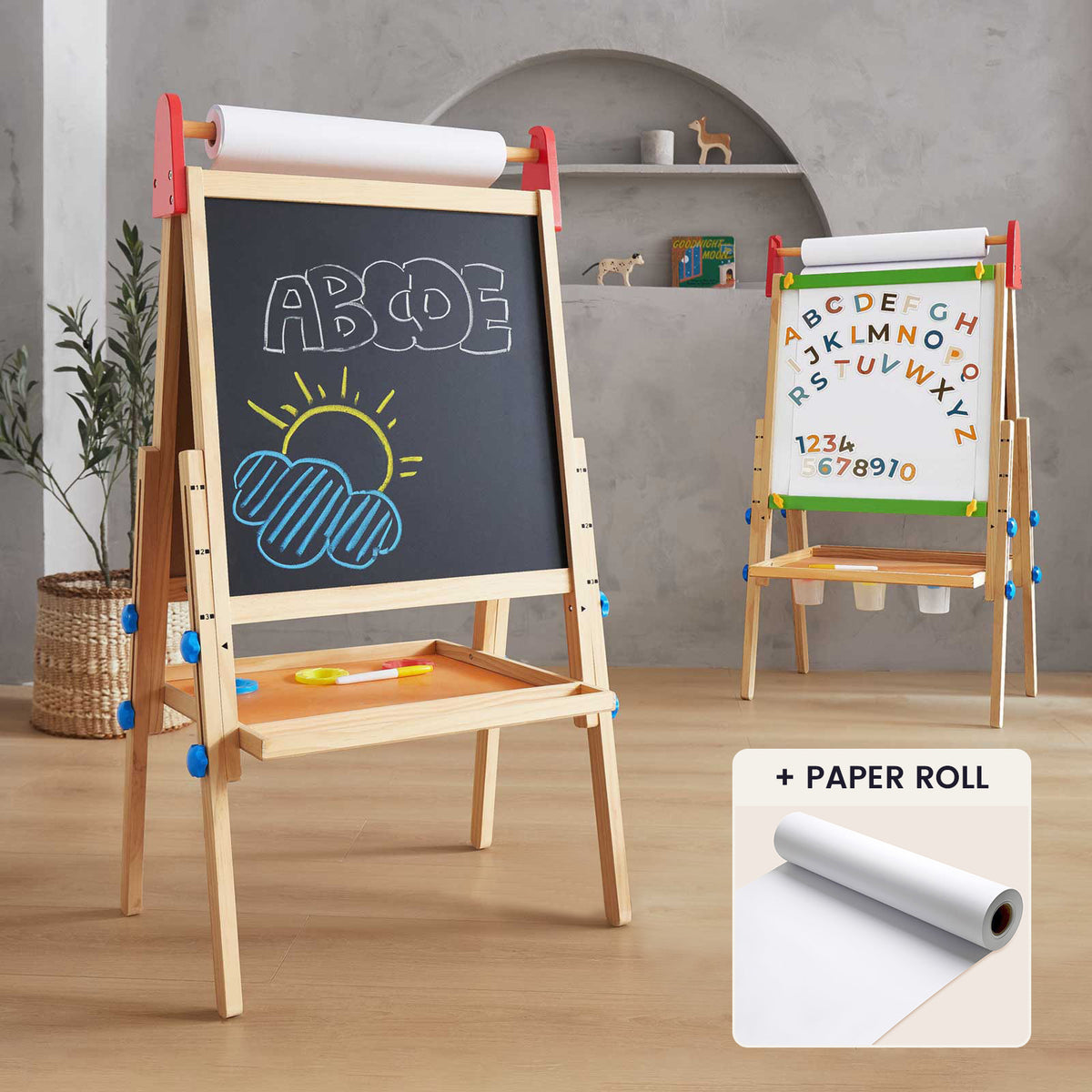 The Tiny Land® 3-in-1 Art Easel & Paper Roll Set displays colorful drawings and letters on its chalkboard, with another easel showing alphabet letters and numbers. An inset highlights the included paper roll for creative projects.