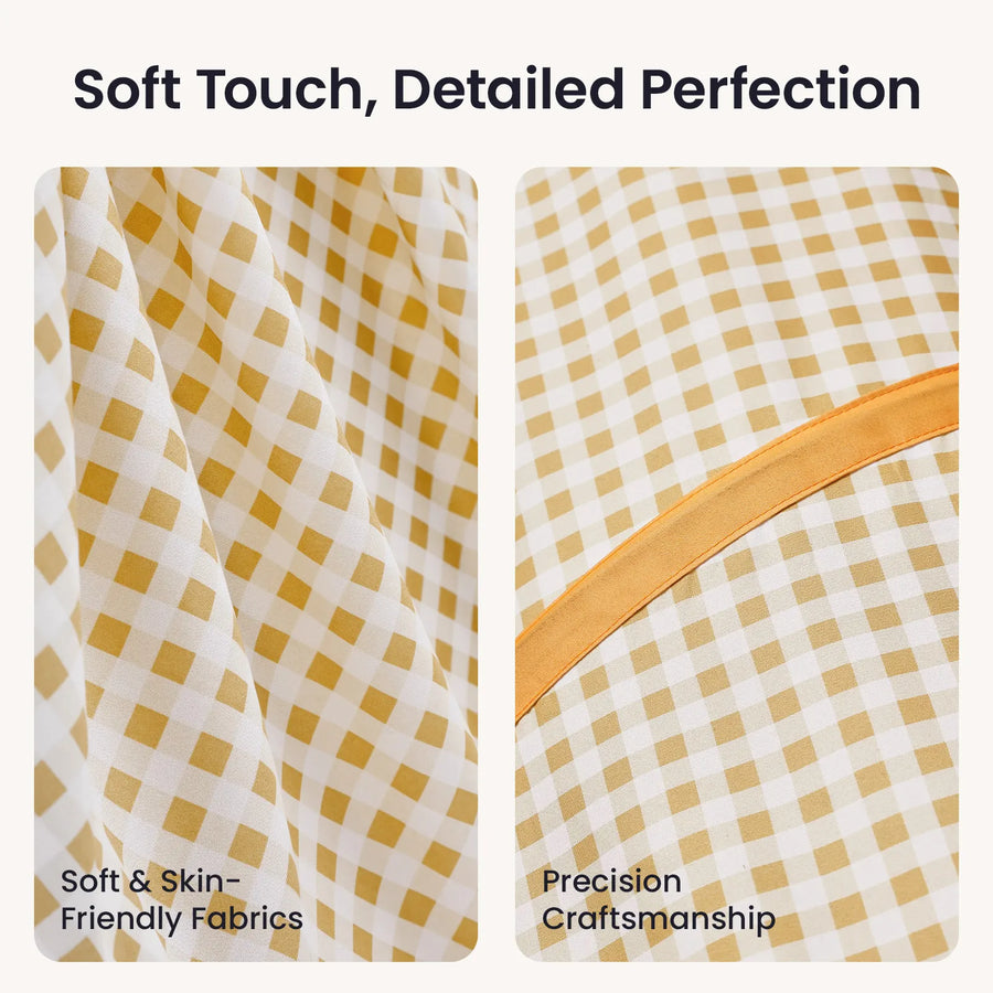 Close-up of yellow and white gingham fabric on the Tiny Land® Adventure Play Tunnel, showing soft texture on the left and a precision-stitched orange seam on the right, under the heading Soft Touch, Detailed Perfection.|Yellow