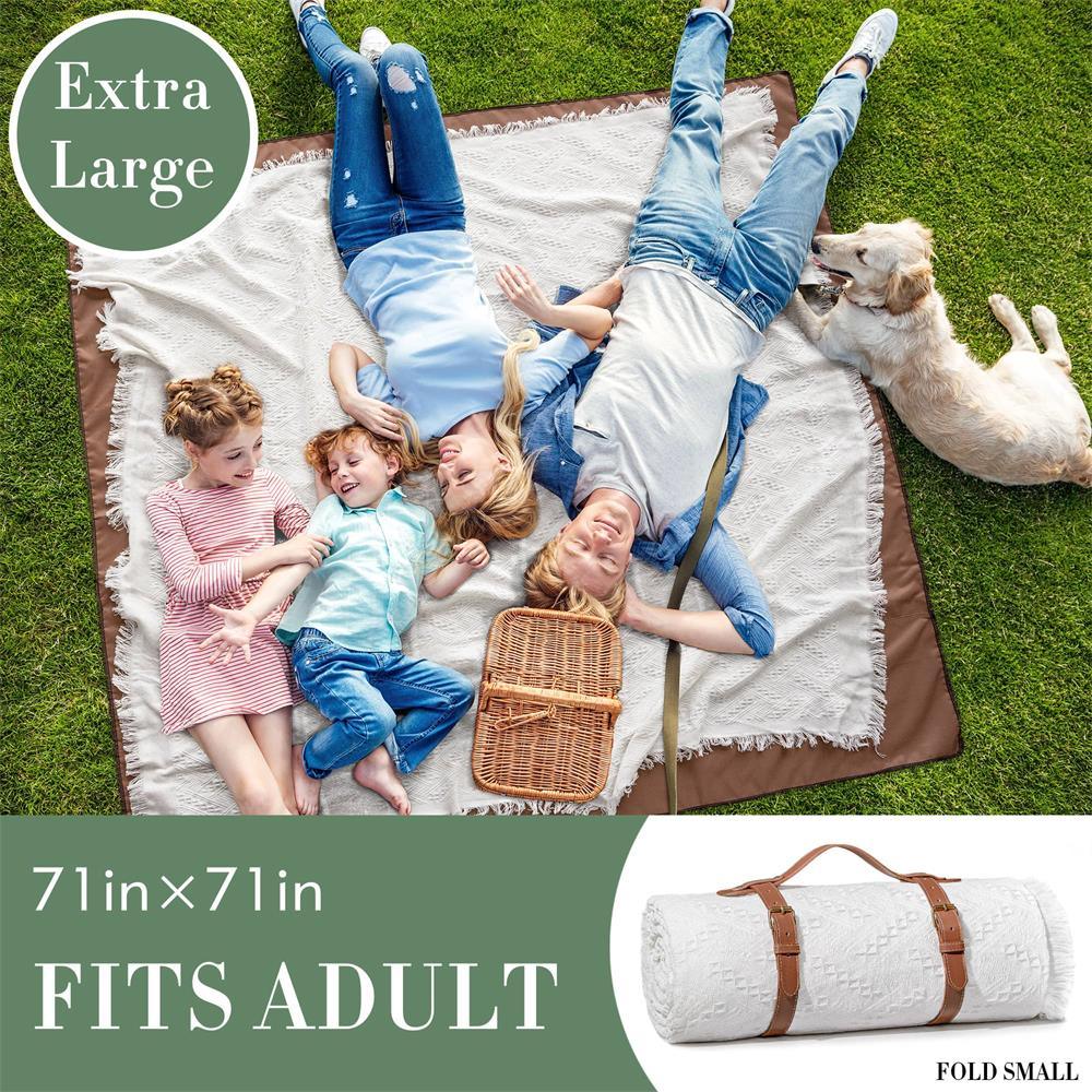 A family of four and a dog enjoy the Tiny Land® Picnic Blankets for Family, a 71x71-inch outdoor blanket by Tiny Land. Shown on green grass, it fits adults and comes rolled up with a strap labeled Extra Large and FITS ADULT.