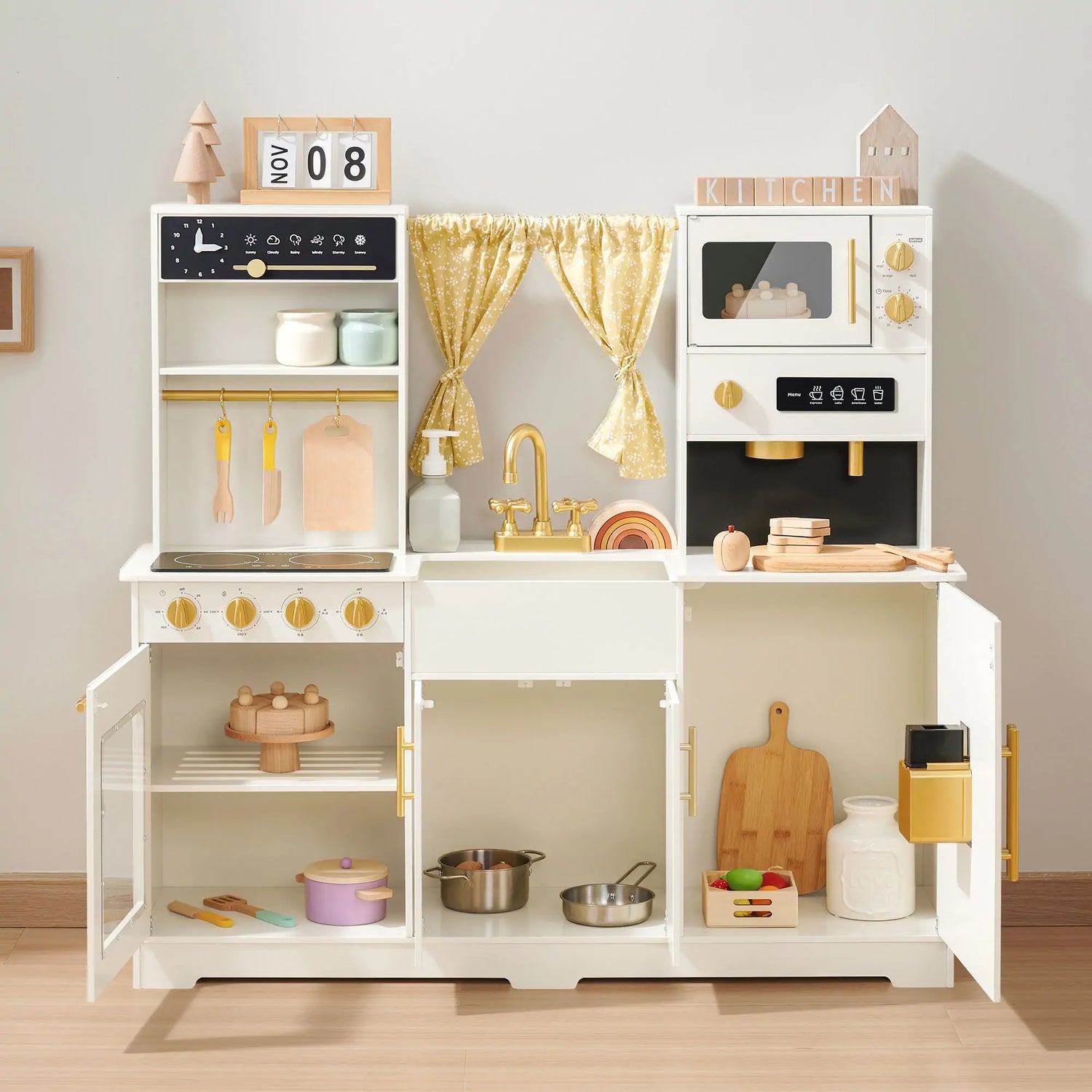 A creamy white play kitchen filled with all kinds of fun and beautiful kitchen toys.