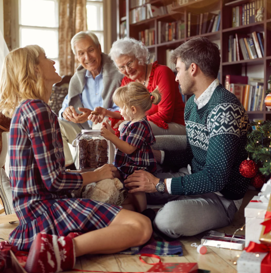 A family is enjoying happy activities together in a home filled with Christmas atmosphere, with everyone smiling joyfully.