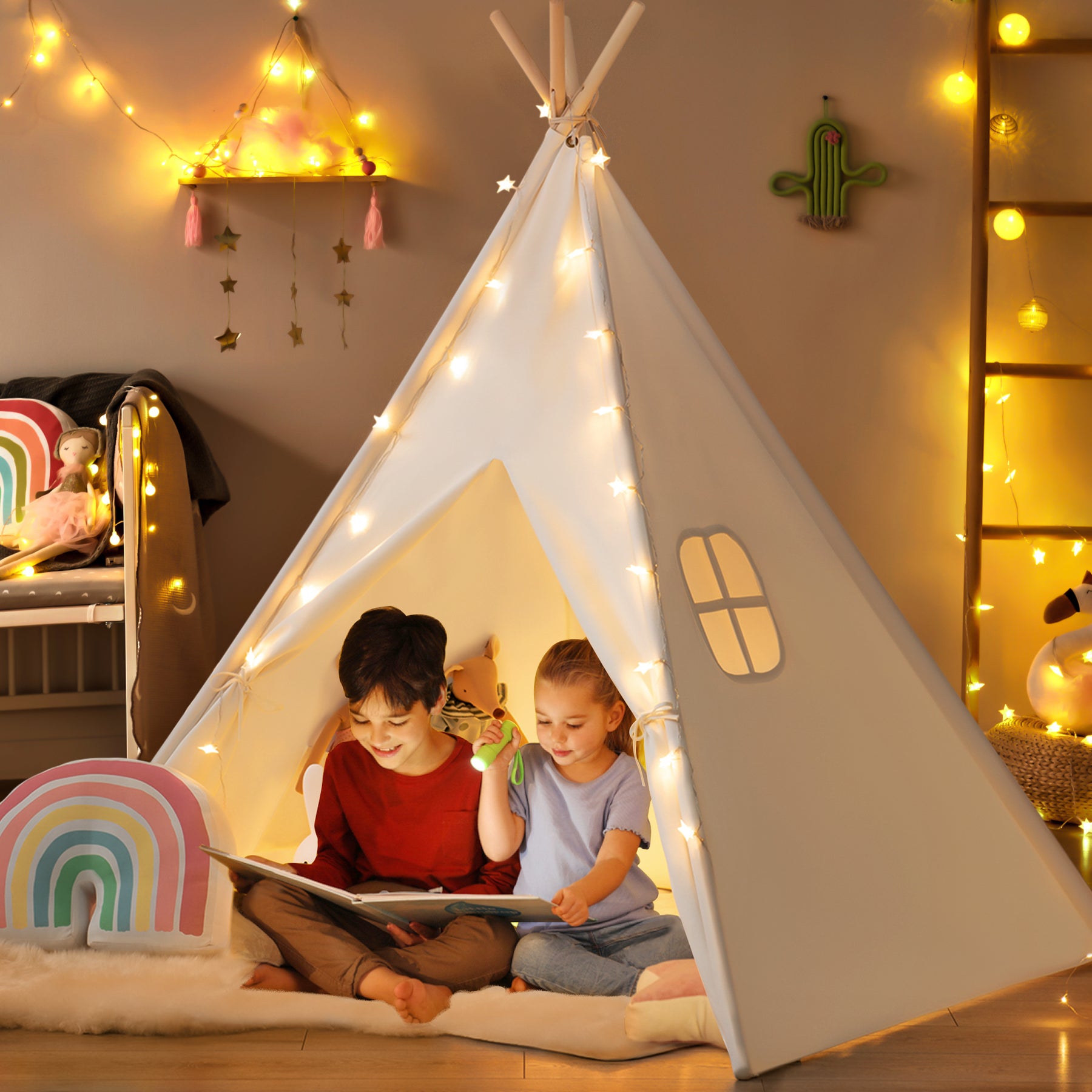 Two children sit inside the Tiny Land® Ultimate Reading Retreat: Premium Teepee & Corduroy Lounger by Tiny Land INC, decorated with string lights, reading a book together. The cozy room features warm lighting, plush toys, and colorful decorations, creating the perfect reading nook.|Soft Teal