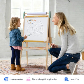 A woman kneels next to a young girl who is drawing houses on the Tiny Land® 3-in-1 Art Easel for Kids & Paper Roll Set by Tiny Land, with a whiteboard labeled “Dream Land” set on its adjustable height frame. Both are smiling in a bright room. Icons below highlight benefits such as enhancing concentration, fostering storytelling skills, and promoting hand-eye coordination.|green