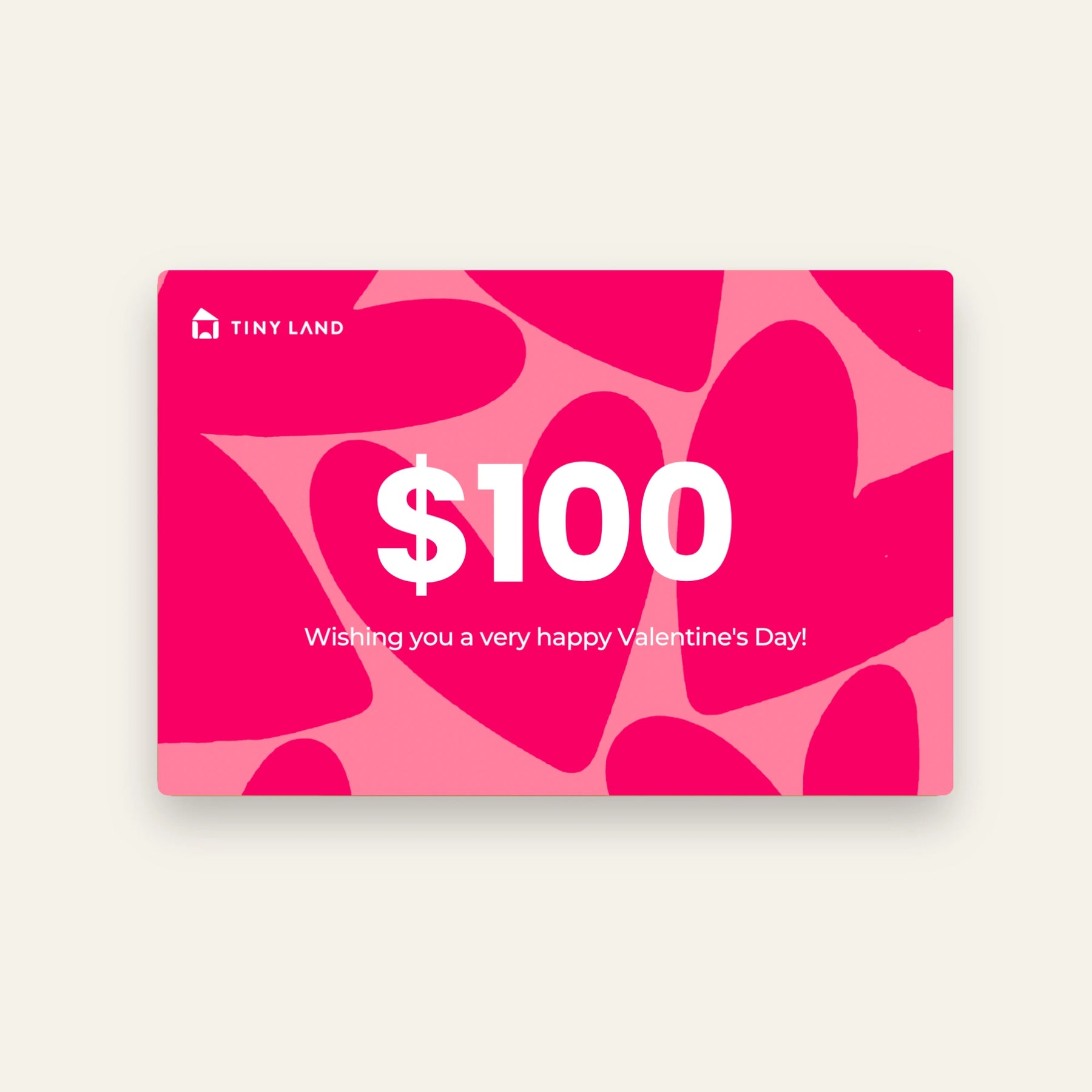 A $100 Tiny Land® Gift Card from Tiny Land featuring a pink and red heart background and the message "Wishing you a very happy Valentines Day!" in white text. Perfect as an online gift for someone special!.