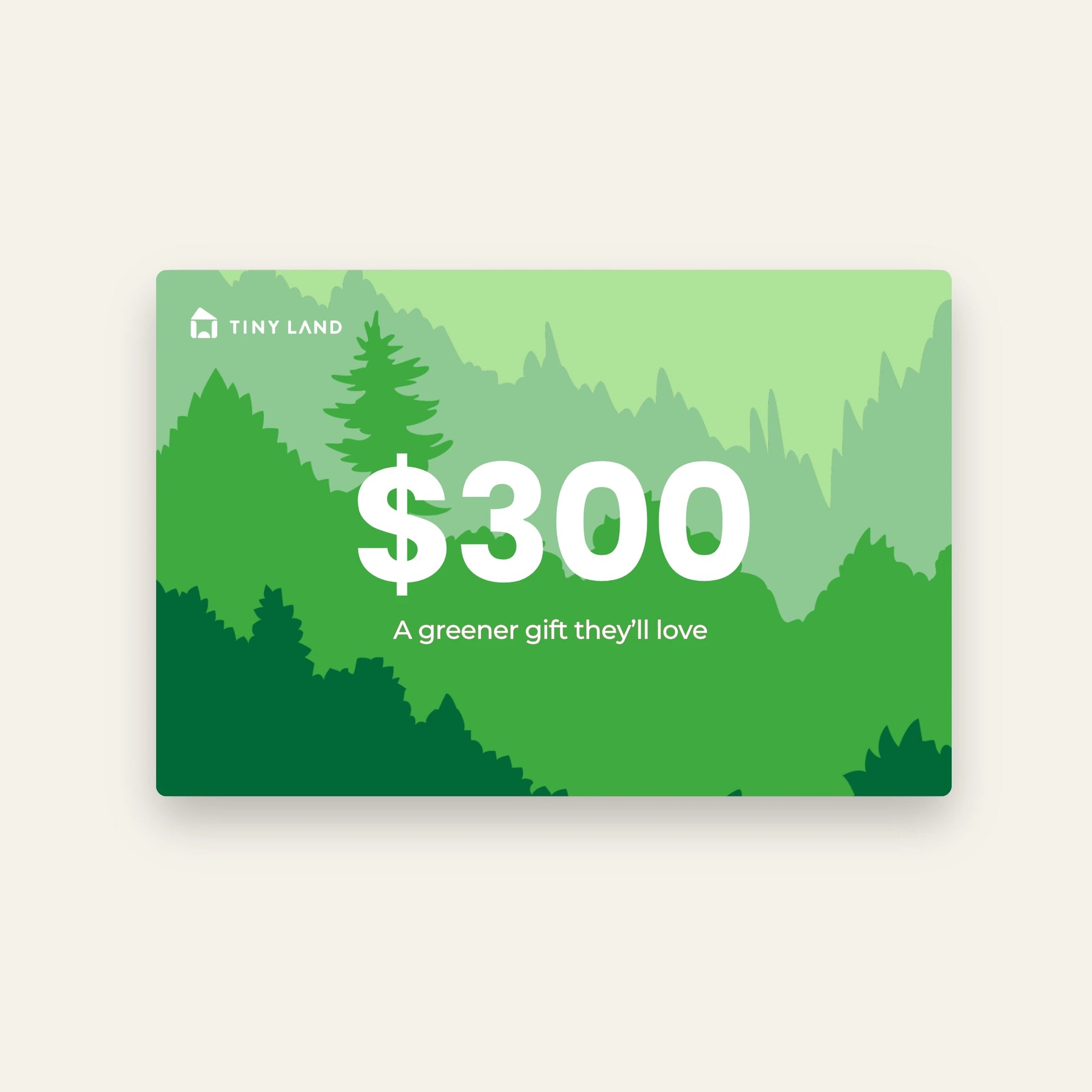 A green Tiny Land® Gift Card with layered forest graphics displays $300 in bold white text above the phrase "A greener gift they’ll love." The Tiny Land logo appears in the top left corner.