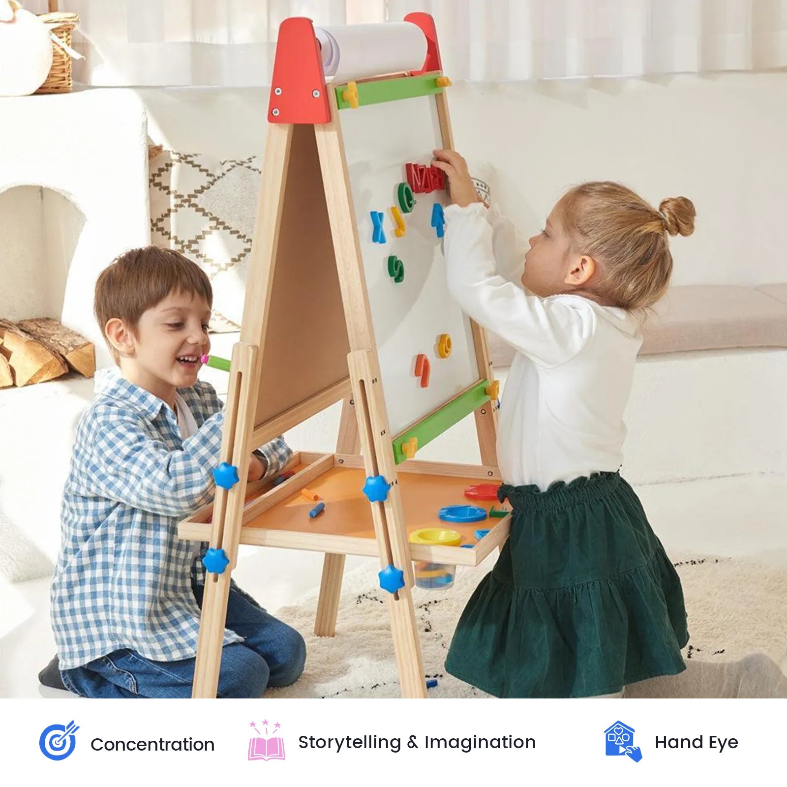 Two young children play and make art together on the Tiny Land® 3-in-1 Art Easel & Paper Roll Set in a bright room. The girl places shapes on the whiteboard while the boy smiles and watches. Icons below highlight benefits such as concentration and imagination, showcasing this creative set from Tiny Land.