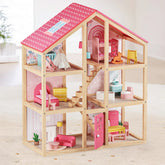 The Tiny Land® Sweetwood Love Dollhouse, by Tiny Land, features pink accents, multiple rooms with colorful décor, wooden furniture, stairs, and an open side for play. Detailed household items are included. Dolls not included.
