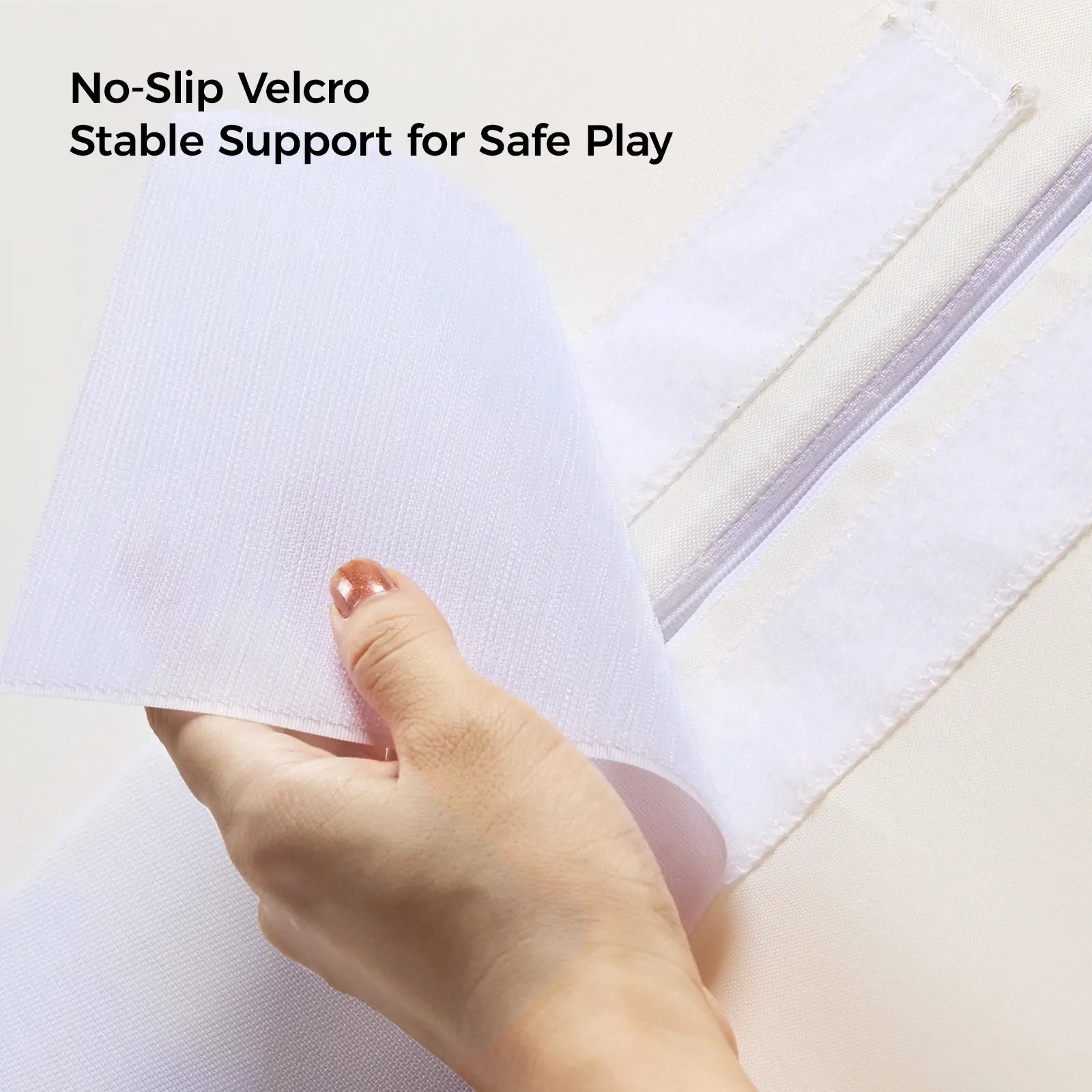 A hand peels back white Velcro on Tiny Land® PlayNest Climbing Blocks by Tiny Land INC, with text above: No-Slip Velcro Stable Support for Safe Play.