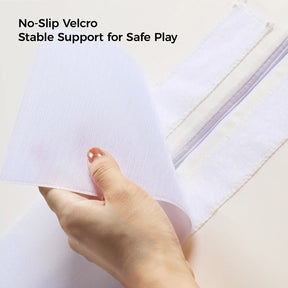 A hand peels back white Velcro on Tiny Land® PlayNest Climbing Blocks by Tiny Land INC, with text above: No-Slip Velcro Stable Support for Safe Play.