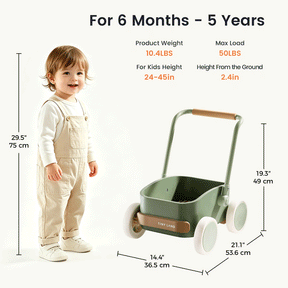 A toddler stands by the Test Tiny Land® JoyRide Baby Walker with Blocks - Sage, featuring white wheels, tan handles, a wooden storage box; for ages 6m–5y, adjustable speed, 10.4 lbs weight, max load 50 lbs, and 19.3 in height.