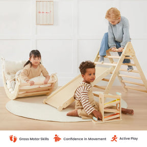 Three young children play indoors with the Tiny Land® 7-in-1 Montessori Climbing Set with Play Pad. One climbs a Pikler triangle from the set, one relaxes in the rocker, and another enjoys a marble run on the padded play cushion. Icons below showcase benefits for gross motor skills, building confidence, and encouraging active play.