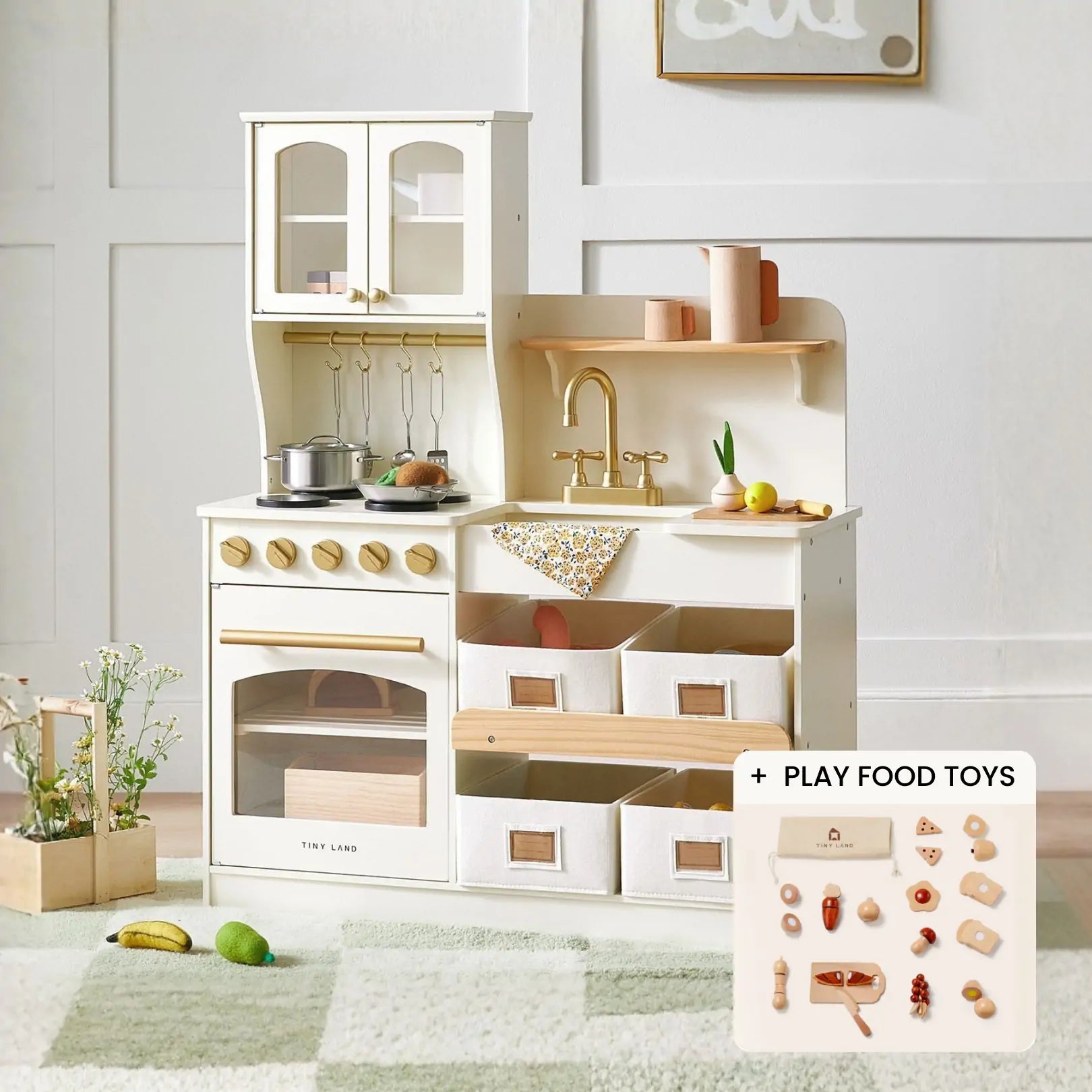 The Tiny Land® Smart Storage Kitchen Cooking Set by Tiny Land features pots, pans, utensils, a sink, stove, oven, storage bins, and play food toys—perfect for pretend play. Inset shows assorted play food items on a soft rug against a white wall.