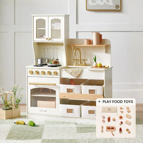 The Tiny Land® Smart Storage Kitchen Cooking Set by Tiny Land features pots, pans, utensils, a sink, stove, oven, storage bins, and play food toys—perfect for pretend play. Inset shows assorted play food items on a soft rug against a white wall.