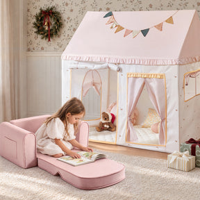 A young girl reads a book while sitting on a Tiny Land® Cozy Nook – GentleSnug Chair & Playhouse Tent.|Pink