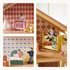 The Tiny Land® Sweetwood Pegasus Dollhouse features three rooms with patterned wallpaper: a nursery with crib and doll, a bedroom with green bed and poseable family dolls, and a kids’ room with bunk beds. Includes Tiny Land wooden dolls.