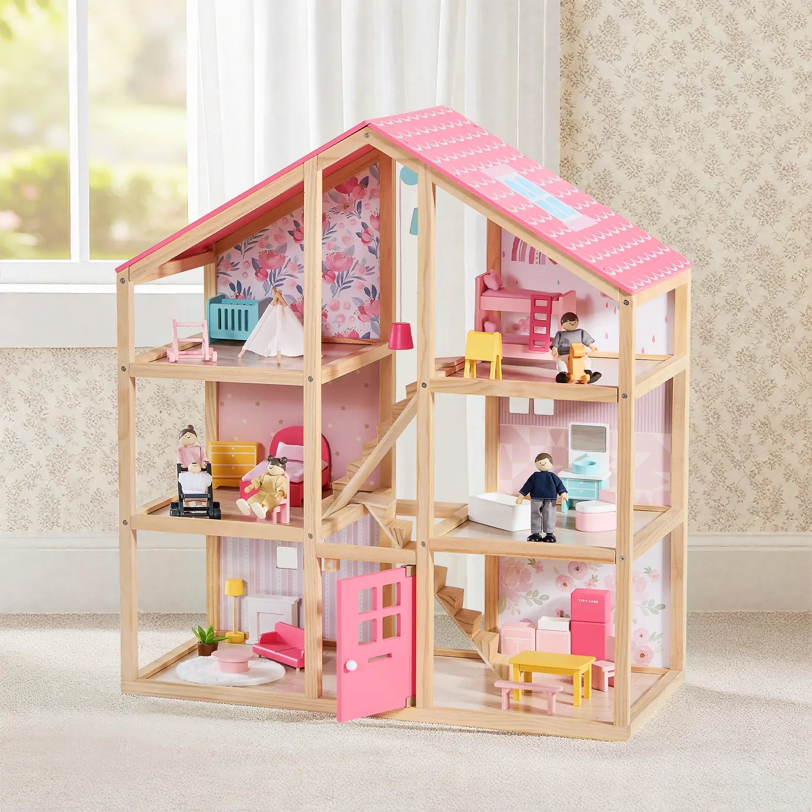 The Tiny Land® Sweetwood Love Dollhouse & Wooden Dollhouse Dolls by Tiny Land INC features a pink roof, furnished rooms, doll family set, staircase, and miniature furniture—perfect for imaginative play in children's rooms.