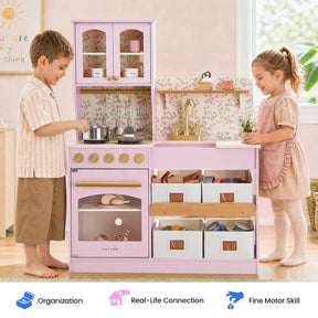 Two young children play with the Tiny Land® Wooden Play Kitchen with Storage for Creative Toddlers, cooking and organizing pretend meals using the included cookware. Spacious storage bins are tucked under the counter of this multifunctional Tiny Land kitchen set. Icons below highlight features such as organization, real-life skill building, and fine motor development.|Sakura Pink