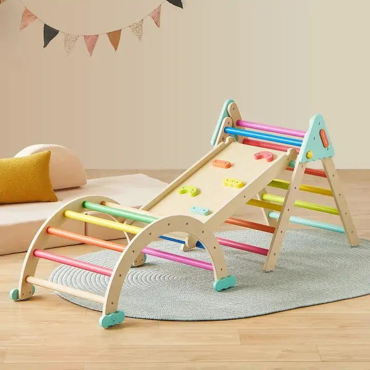 The Tiny Land® 7-in-1 Rainbow Pikler Triangle Set by Tiny Land, with a reversible ramp and rainbow rungs, is displayed on a round rug in a cozy playroom.