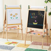 Two Tiny Land® 3-in-1 Art Easels for Kids - Morandi stand on a colorful rug. One shows flower art on paper, the other displays “123 SAIL” and a boat under the sun in chalk. Paint trays are attached below each drawing surface.