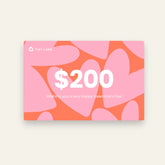 A $200 Tiny Land® Gift Card by Tiny Land featuring large pink and orange hearts in the background with "Wishing you a very happy Valentine’s Day!" printed on it.