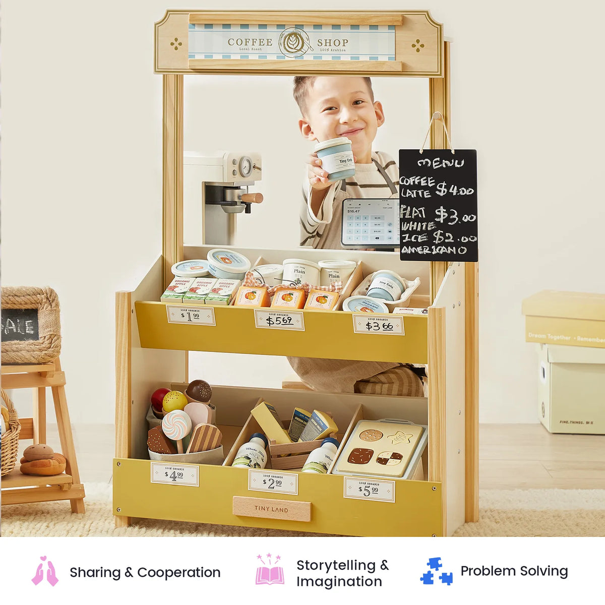 A child smiles and holds a coffee cup at the Tiny Land® Kid’s Grocery Store Playset, surrounded by play food items and a small chalkboard menu. This interactive shopping toy from Tiny Land encourages pretend play as little ones explore their imagination. Icons and text below highlight sharing, problem solving, and creativity—just like in a real grocery store.