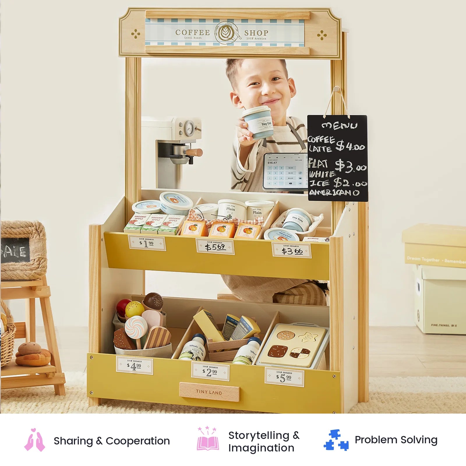 A child smiles and holds a coffee cup at the Tiny Land® Kid’s Grocery Store Playset, surrounded by play food items and a small chalkboard menu. This interactive shopping toy from Tiny Land encourages pretend play as little ones explore their imagination. Icons and text below highlight sharing, problem solving, and creativity—just like in a real grocery store.