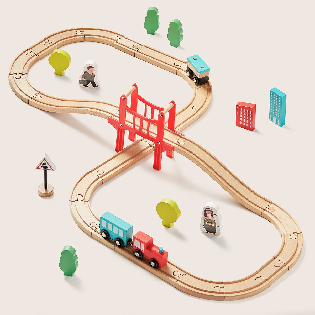 The Tiny Land® Wooden Track Trains by Tiny Land INC features looping tracks, a red bridge, two trains, small trees, people figures, a road sign, building blocks, and is compatible with major brands.