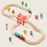 The Tiny Land® Wooden Track Trains set by Tiny Land features looping tracks, a red bridge, colorful trains, trees, signs, buildings, and figures—compatible with major brands for endless educational fun.