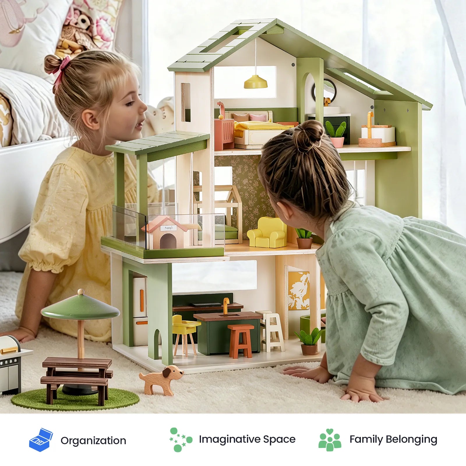 Two young girls play with the Tiny Land® Sweetwood Edge Dollhouse - Green & Pink in a bright, cozy room. Icons below emphasize organization, imaginative play spaces, and the feeling of family belonging. Miniature furniture accents the scene, including a toy bench, dog, and umbrella from Tiny Land.|Green