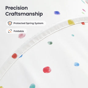Close-up of white fabric with colorful polka dots on the Tiny Land® Adventure Play Tunnel, highlighting neat stitched seams. Text on image: “Precision Craftsmanship,” “Protected Spring System,” and “Foldable.”.|white