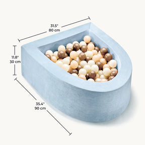 The Tiny Land® PlayNest Ball Pit with 200 ocean balls features a soft, light blue high-density foam design and includes white, beige, and brown ocean balls. Dimensions: 31.5 x 35.4 x 11.8 in (80 x 90 x 30 cm) with measurement lines shown.