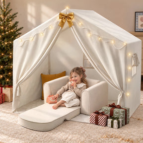 A young girl sits inside a cream-colored Tiny Land Cozy Nook Bundle, featuring star lights and a convertible floor chair, while holding a toy phone.|Fabric