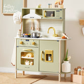 The Tiny Land® PopJoy Play Kitchen - Pink / Green by Tiny Land is a pastel green wooden toy kitchen set featuring a pretend stove, oven, sink with faucet, microwave, utensils, and toy food. The words “better together” appear on the wall. This charming and organized play kitchen scene is perfect for inspiring imaginative pretend play in children.|Sage