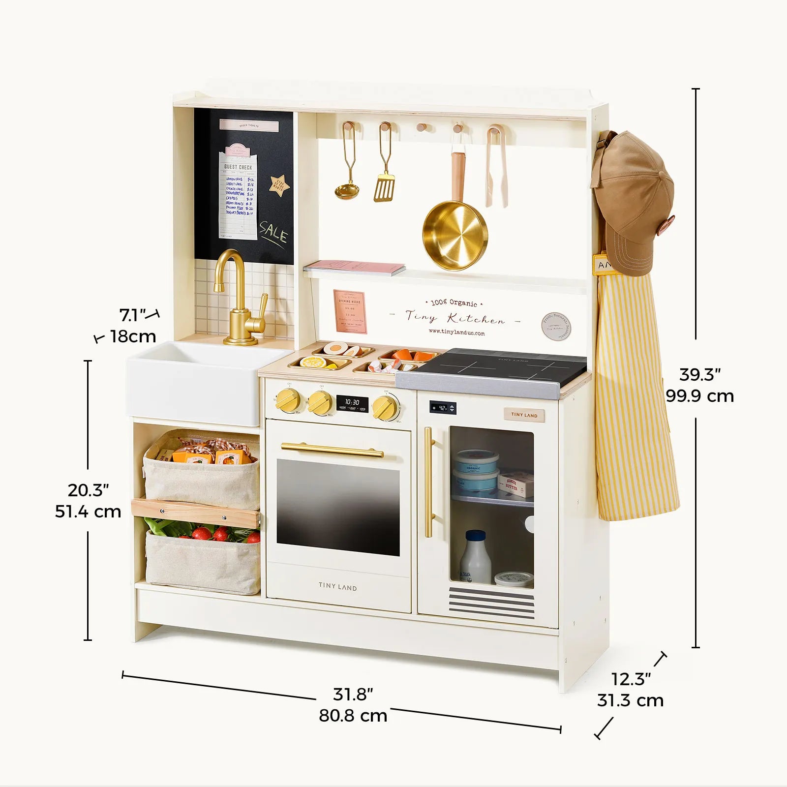 Introducing the Tiny Land® BistroSwitch Kitchen & Fridge Set by Tiny Land—a wooden kids’ play kitchen featuring gold handles, hanging utensils, a chef’s hat, striped apron, baskets, sink, stove, oven, and microwave. Measurement lines in black and gold display height, width, and depth in both inches and centimeters—making this interactive toy kitchen ideal for imaginative pretend play adventures.