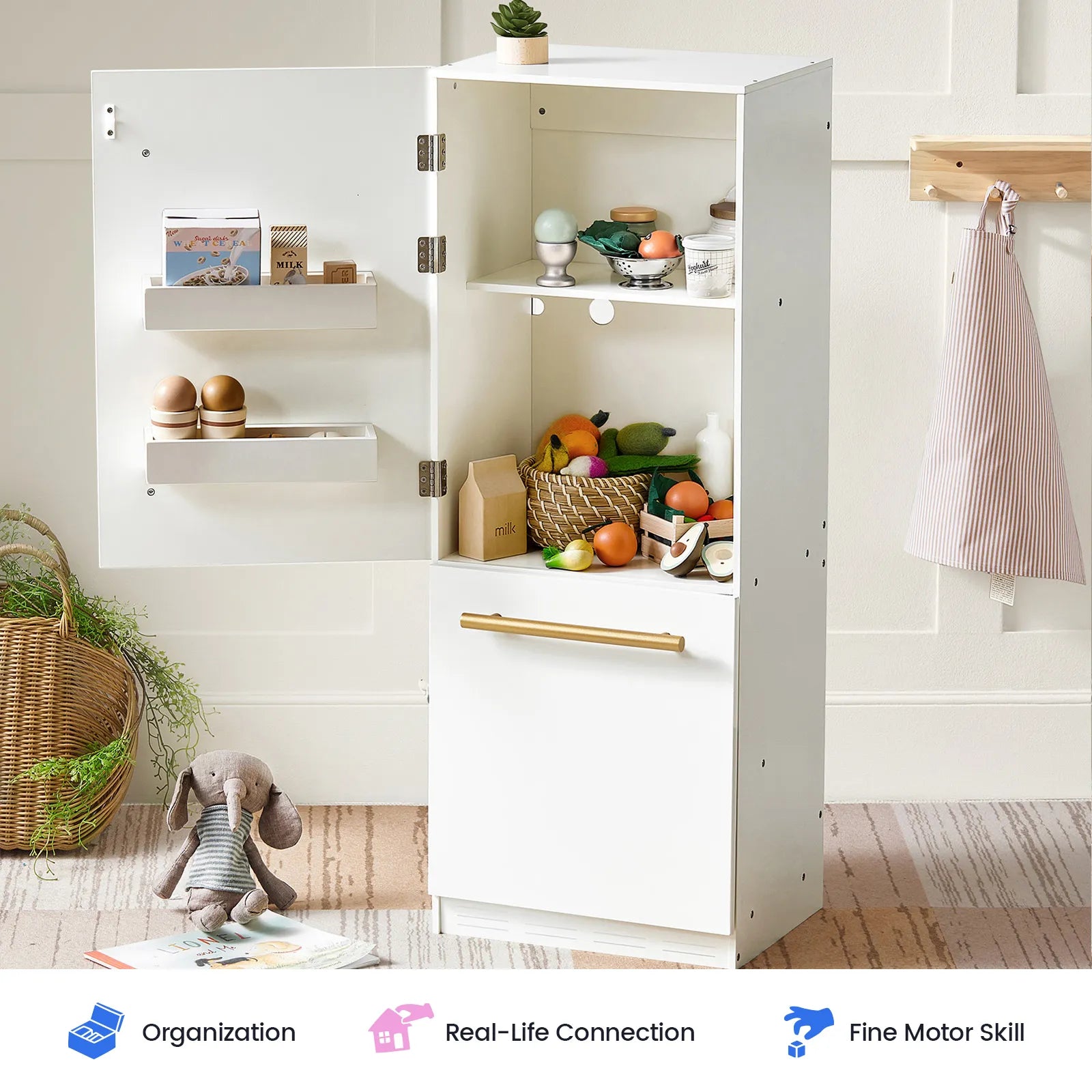The Tiny Land® Play Kitchen Accessories – Play Kitchen Fridge is a white wooden cabinet refrigerator for kids, filled with play food and kitchen accessories for realistic pretend play. A stuffed rabbit sits beside the fridge, while icons below showcase benefits like organization, real-life connection, and fine motor skill development.